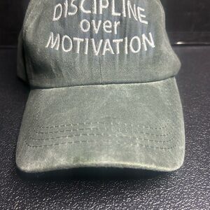 Green Dad Hat with “Discipline Over Motivation” in White Embroidered